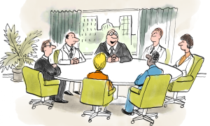 several members of a business team sitting down for a meeting